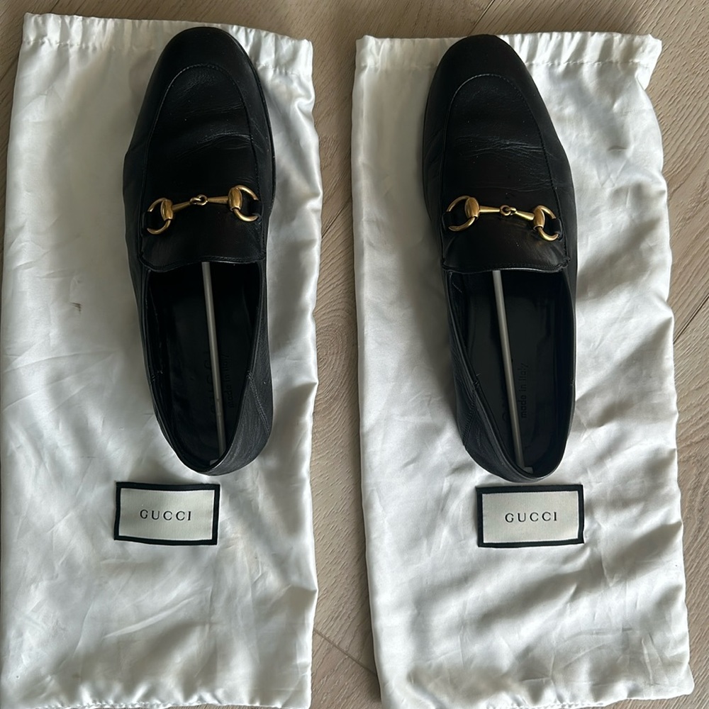Gucci means black leather loafers
